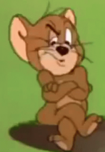 Jerry From Tom And Jerry Is Sitting On A Rock With His Arms Crossed And Making A Funny Face . GIF