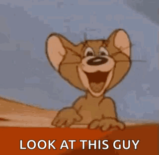 Jerry From Tom And Jerry Is Smiling And Pointing At The Camera . GIF