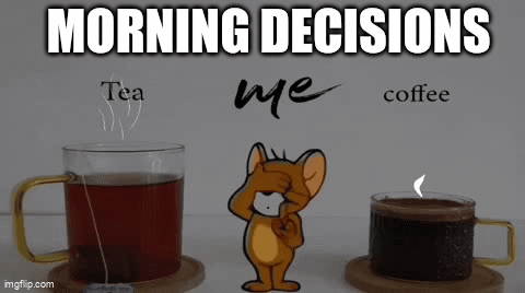 Jerry From Tom And Jerry Is Standing Between Two Cups Of Tea And A Cup Of Coffee . GIF