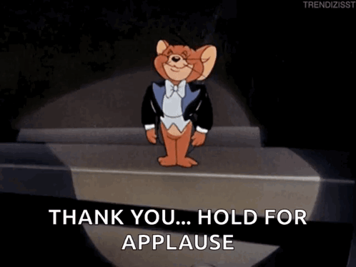 jerry from tom and jerry is standing on a stage and says thank you hold for applause