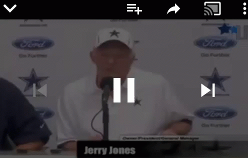 Jerry Jones Is Talking Into A Microphone In Front Of A Ford Logo GIF