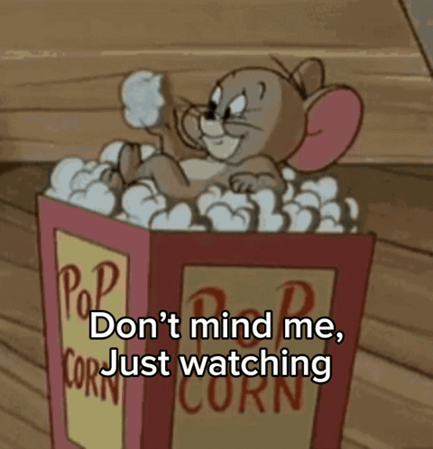 Jerry Sitting in Popcorn Box Watching
