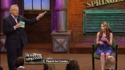 Jerry Springer Holding Cellphone GIF