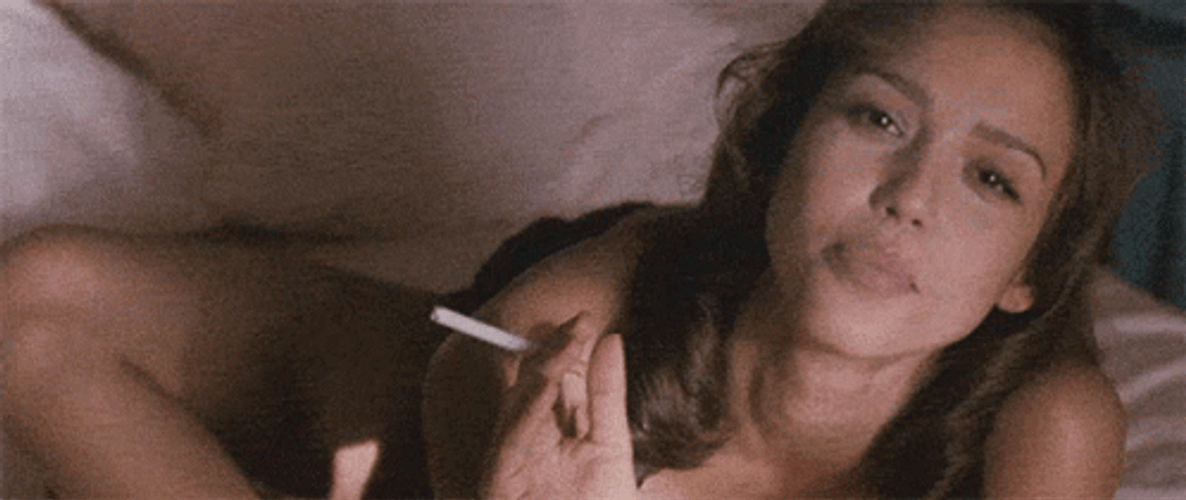 Jessica Alba Holding Cigarette While Lying In Bed GIF