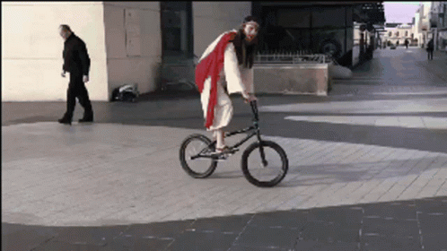 Jesus Christ Costume Riding Bicycle GIF