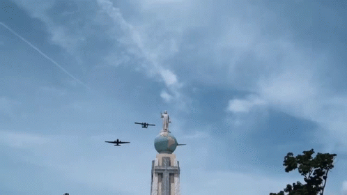 Jesus Statue on Globe With Planes