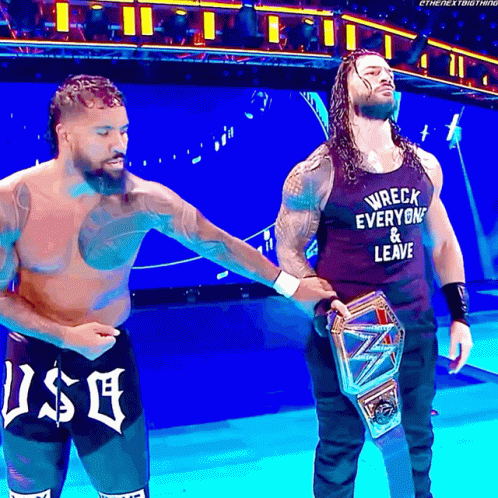 Jey Uso Holds Roman Reigns Hand GIF