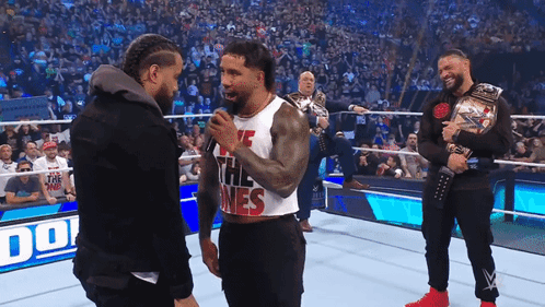 Jey Uso Kicking Roman Reigns GIF