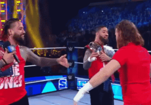 Jey Uso Triple Person Handshake GIF