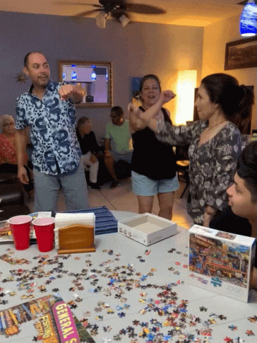 Jigsaw Puzzle Pieces Scattered On Table GIF
