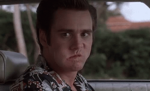 Jim Carrey Chewing Playful Face GIF
