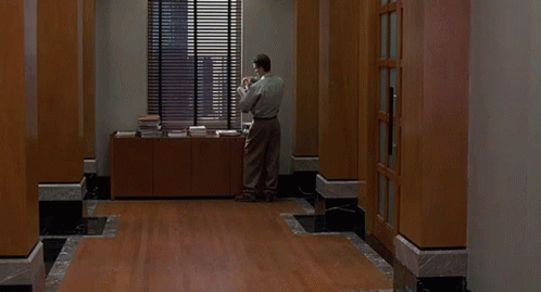 Jim Carrey Leaving Work Not Listening GIF