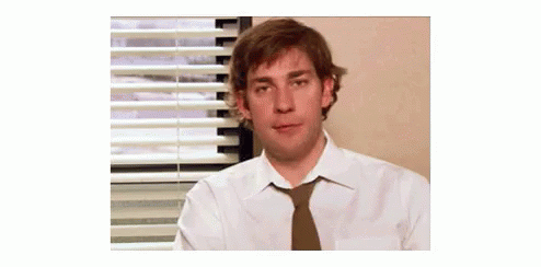 Jim Halpert The Office Smirk Shoulder Shrug GIF