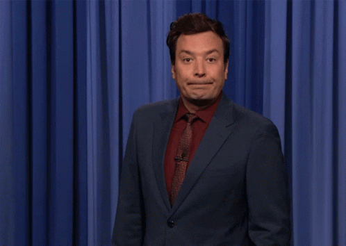 Jimmy Fallon Shocked in Front of Blue Curtain