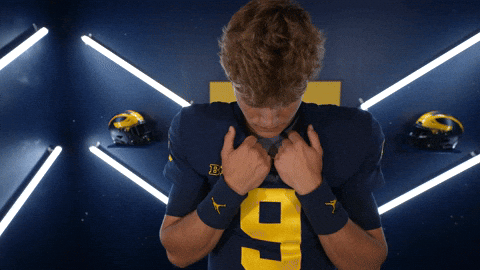 Jj Mccarthy Holding His Shirt Neckline GIF