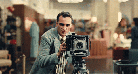 Joaquin Phoenix Snapping Picture On Vintage Camera GIF