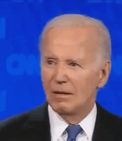 Joe Biden Is Wearing A Suit And Tie And Making A Funny Face . GIF