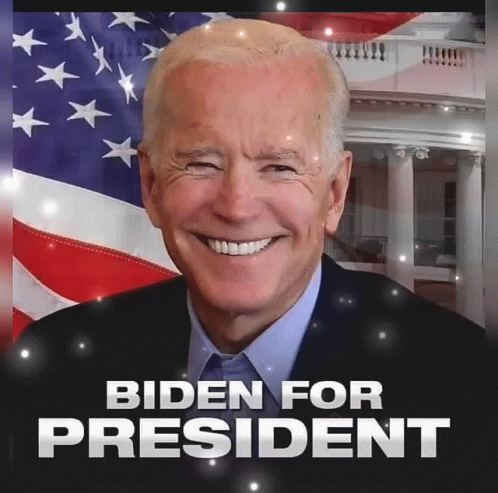 Joe Biden Smiling in Front of American Flag
