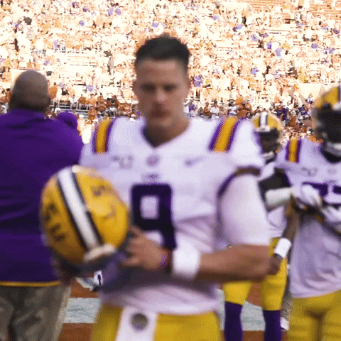 Joe Burrow Player Of Ed Orgeron Holding Helmet GIF
