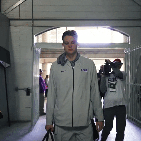 Joe Burrow Player Of Ed Orgeron Walking Inside Building GIF