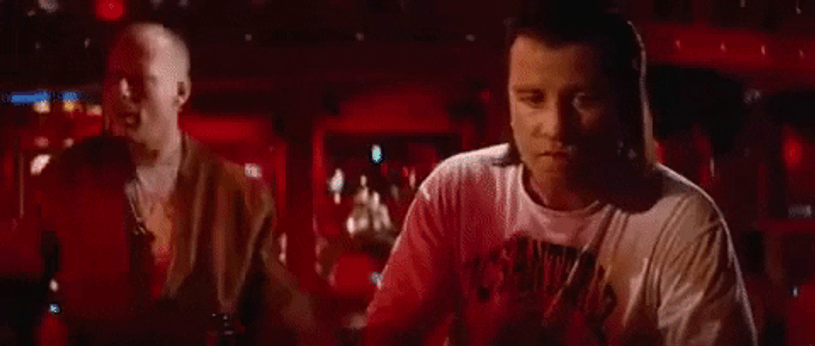 John Travolta Pulp Fiction Staring Bruce Willis GIF