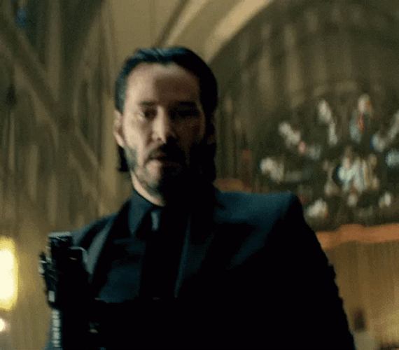 John Wick Offering His Hand GIF