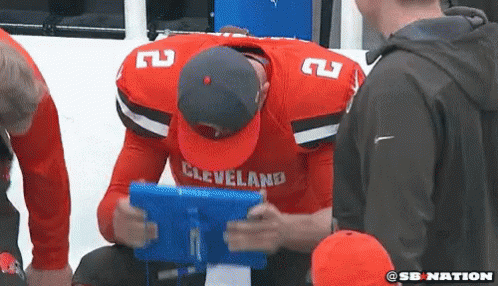 Johnny Manziel Banging Book On Head GIF