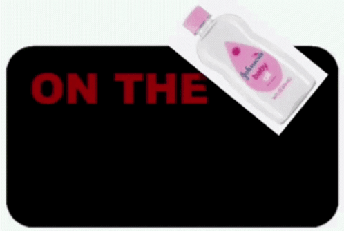 Johnson's Baby Oil Next to Digital Clock