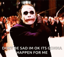 Joker From The Dark Knight Standing In Front Of Crowd GIF