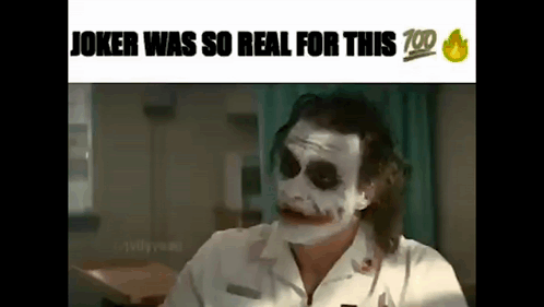 Joker in White Shirt Making Funny Face at Table