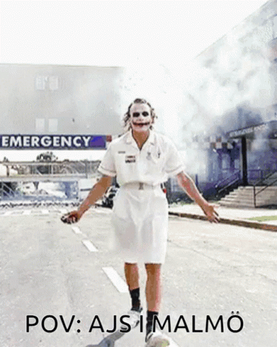Joker Nurse Walking Past Emergency Sign