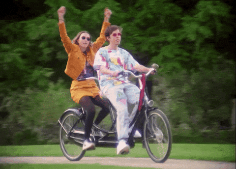 Joyful Biking Duo GIF
