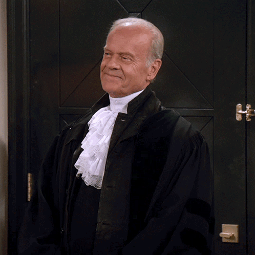 Judge in Robe Saying My Pleasure in Front of Door