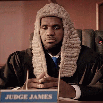 Judge James Sitting at Desk