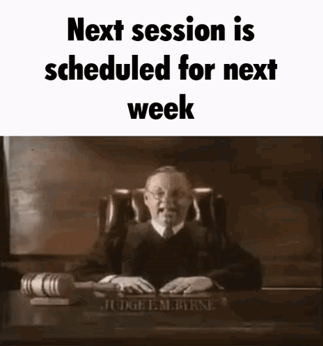Judge Sitting At Desk With Gavel And Nameplate GIF