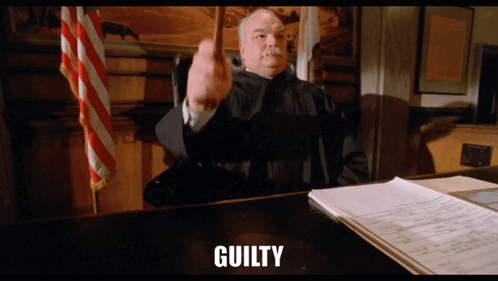 Judge Sitting at GUILTY Desk