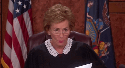 Judge Smiling at Desk