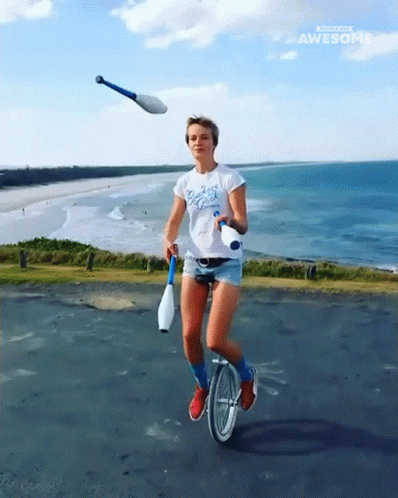Juggling Pins Riding Unicycle GIF