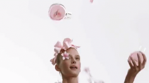 Cute Lady Juggling Make Up GIF
