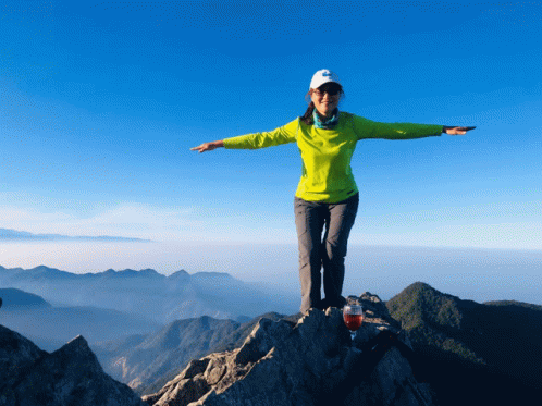 Jumping At The Mountain Peak GIF