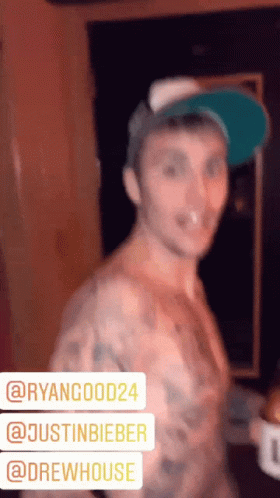 Justin Bieber Holding A Bottle And Tongue Out GIF