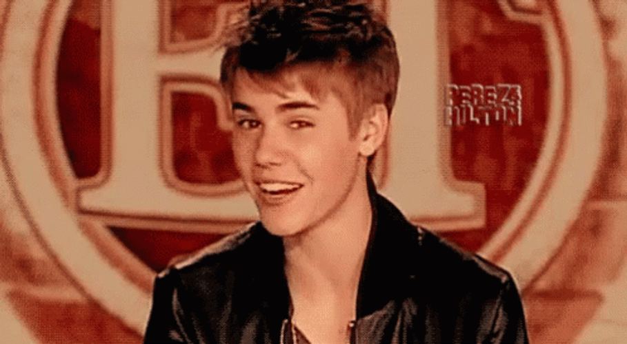 Justin Bieber Doing Eye Winking And Smiling GIF