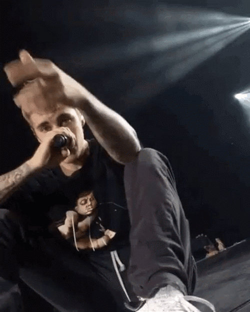 Justin Bieber Holding Microphone And Pointing GIF