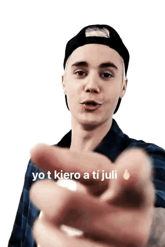 Justin Bieber Is Wearing A Black Hat And Plaid Shirt And Pointing GIF