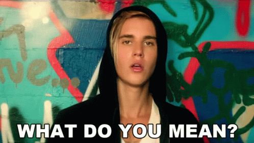 Justin Bieber Is Wearing A Hooded Jacket And Asking What Do You Mean GIF
