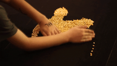 K In Gold Glitters Arranged GIF