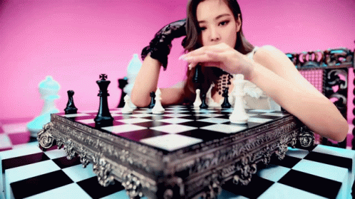 K-pop Jennie Kim Knocking Down Chess Piece GIF