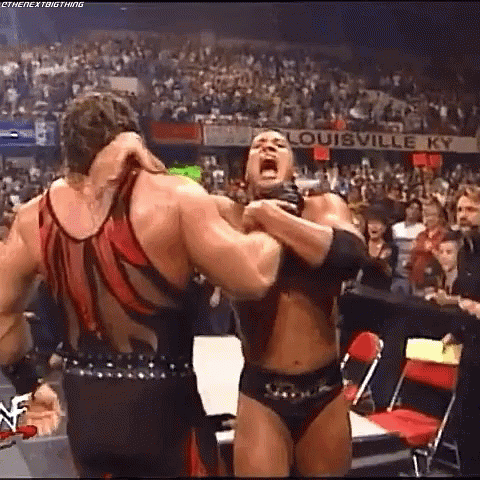 Kane Chokeslam The Rock On Announcers Table GIF