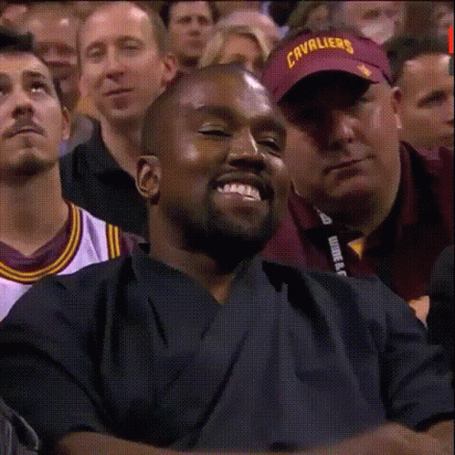 Kanye Caught Smiling GIF
