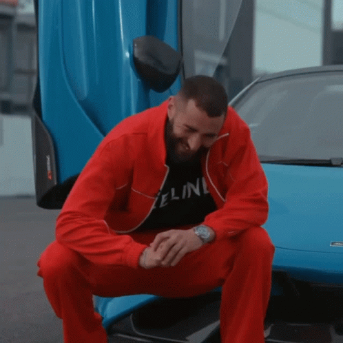 Karim Benzema Red Jacket And Pants Photoshoot GIF